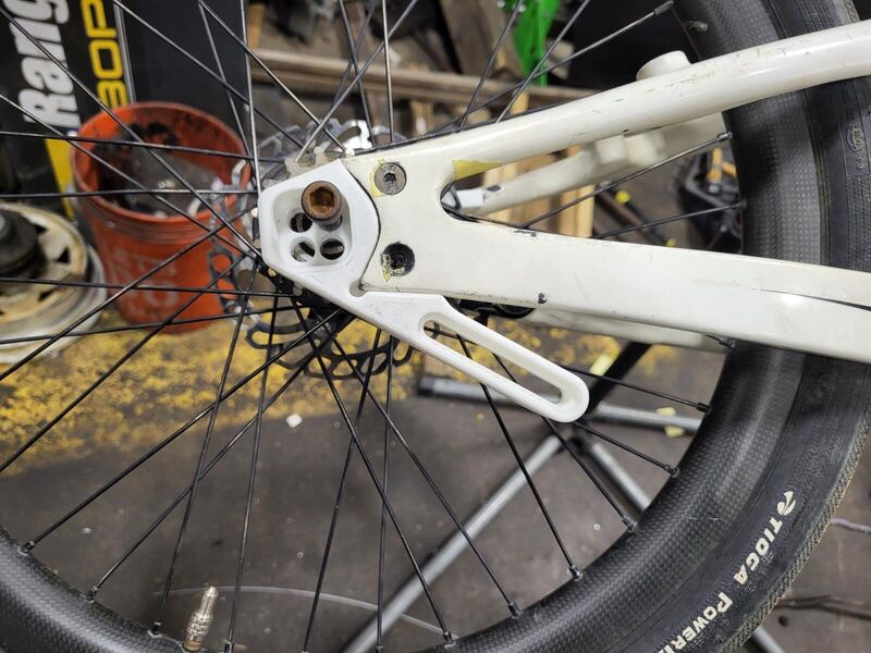 Printed prototype holding a brake caliper on the bike
