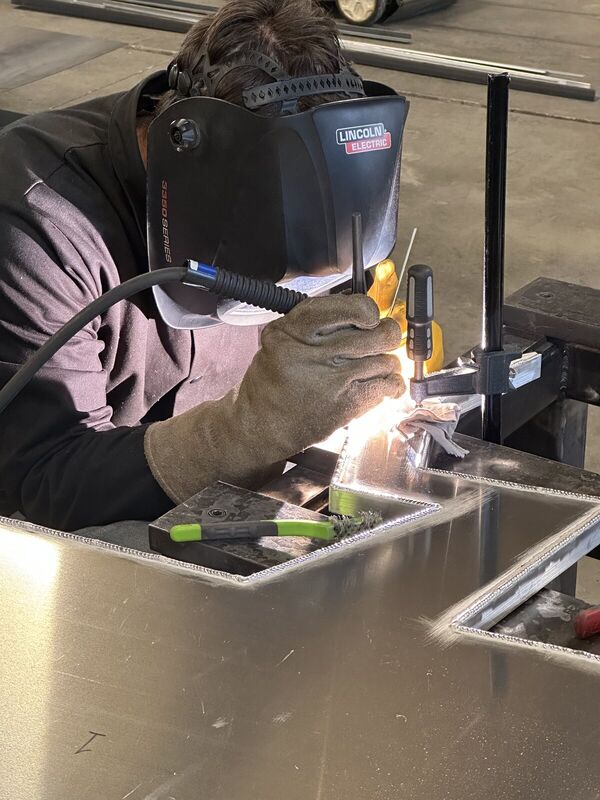 TIG welding the seam of a cloud, close up