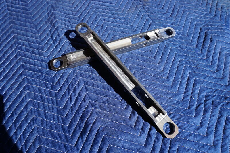 The pair of machined control arms from above