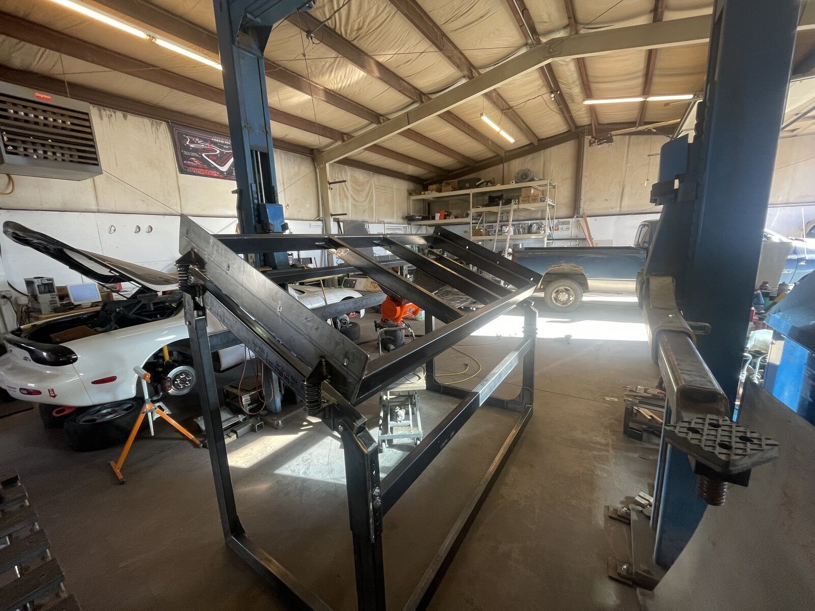 The screener's steel frame standing in the shop